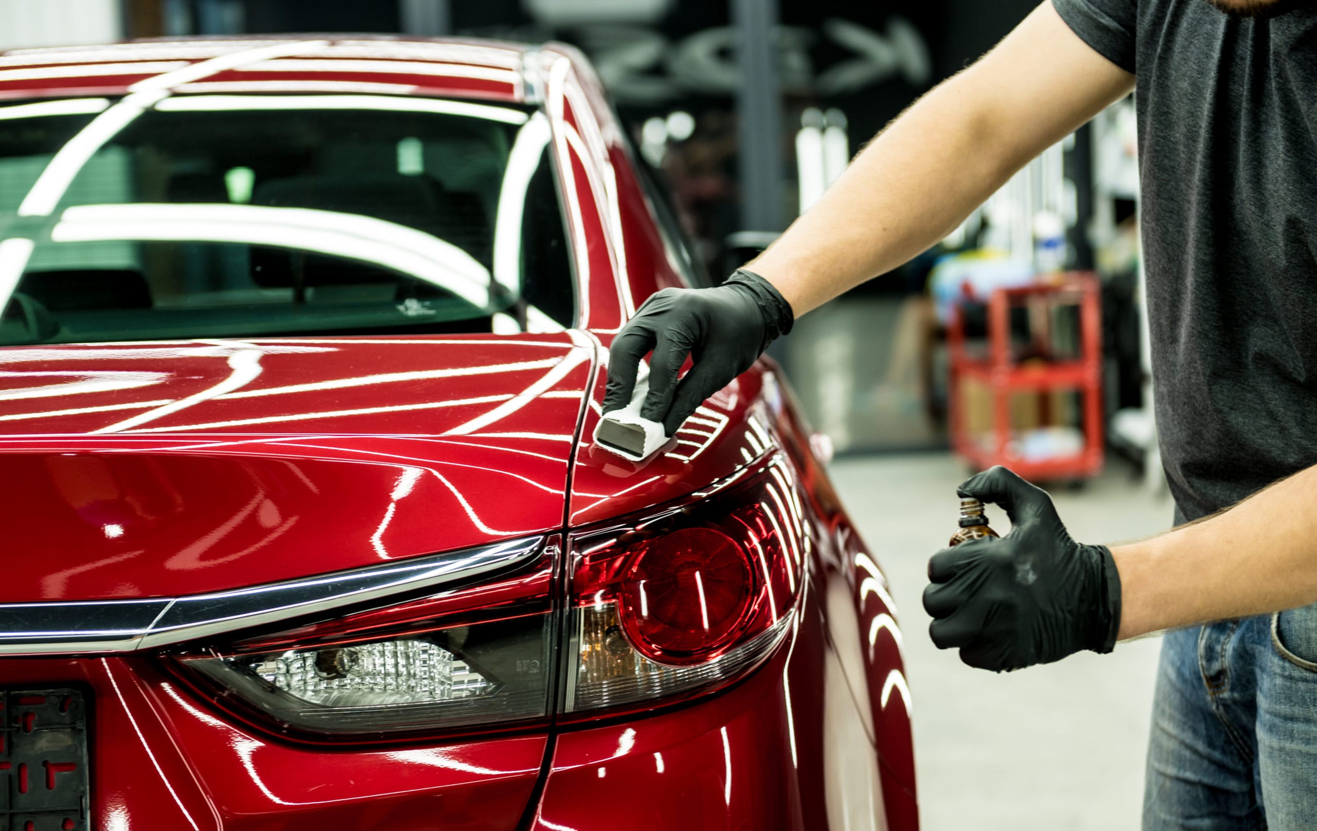 Car,Service,Worker,Applying,Nano,Coating,On,A,Car,Detail.